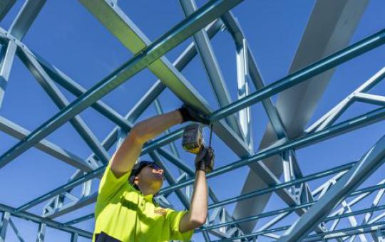 Carpenter installing beam