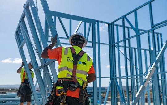 Tradies carrying TRUECORE steel wall frames