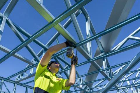 Carpenter installing beam