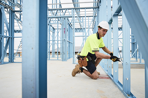 Electrician working with LGS frame on site